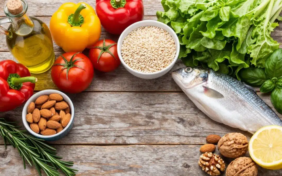 Mediterranean diet ingredients including olive oil, fresh vegetables, fish, and nuts arranged on a wooden table representing foods for fatty liver health